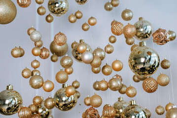 New Year's golden balls hanging on strings