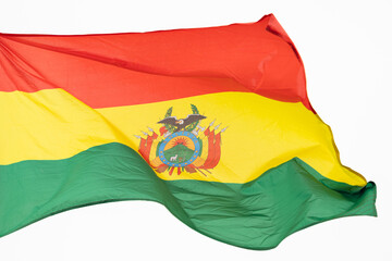 Flag of Bolivia. A large Bolivian flag flutters in the wind. Close-up. Great for news. Bolivia flag on white background