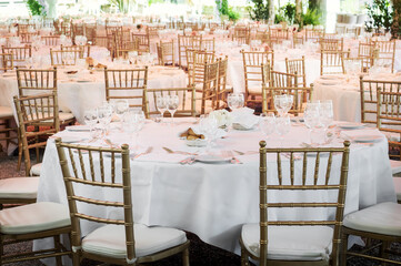 Elegant outdoor banquet tables with chairs