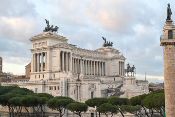 Obraz premium Emmanuel II monument and The Altare della Patria.Trajan Column and Facade of the Victorian in Rome, Italy during the day at sunset.