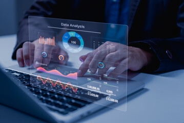 Business development and technology Data analyst for report marketing strategy planning. graph analysis and information on a futuristic virtual interface screen.