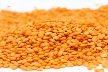 heap of lentils on white background