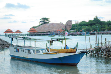 Fototapeta na wymiar Small Boat at Kartini Beach
