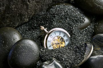 Close-Up 4K Ultra HD Image of Stopwatch Buried in Sand