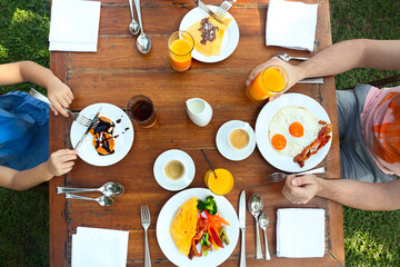 Continental breakfast with pancakes, eggs, bacon, orange jiuce and coffee. Top view - obrazy, fototapety, plakaty
