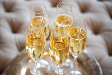 Champagne glasses on silver tray