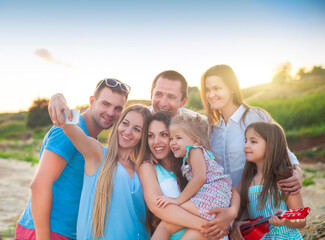 Happy friends selfi pictures at the beach