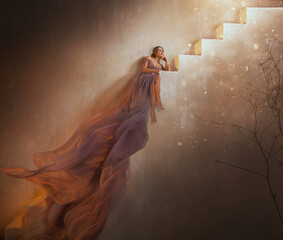Fairy queen fashion model sits on steps of old staircase old style, beauty Princess girl in royal...