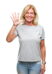 Middle age blonde woman over isolated background showing and pointing up with fingers number five while smiling confident and happy.