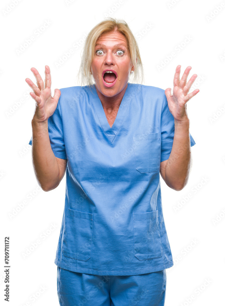 Sticker middle age blonde woman wearing doctor nurse uniform over isolated background crazy and mad shouting