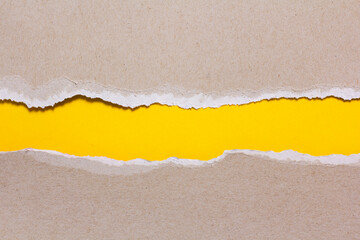 Torn paper on a yellow background