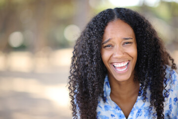 Funny black woman laughing looking at you