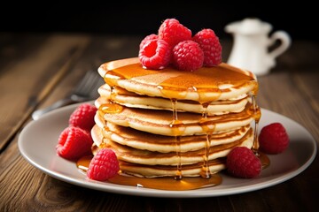 Stack of Pancakes with Maple Syrup and Fresh Raspberries