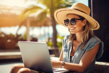 Fotobehang Generative AI technology picture of chilling nomad person sitting near seaside beach pool cafeteria working remotely with laptop © Tetiana