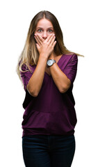 Fototapeta premium Young beautiful blonde elegant woman over isolated background shocked covering mouth with hands for mistake. Secret concept.