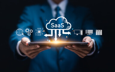 SaaS (software as a service) concept, Businessman show virtual screen of SaaS icons for software services on cloud system. Internet and networking technology.