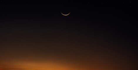 Crescent moon on dusk sky twilight after sundown well free space for text Ramadan Kareem, Eid Al...