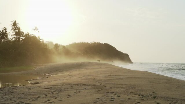 waves crushing onto white beach near Tayrona national park.