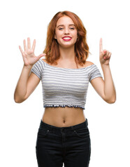 Young beautiful woman over isolated background showing and pointing up with fingers number six while smiling confident and happy.