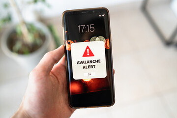 New snow avalanche alert notification on the smart phone. - obrazy, fototapety, plakaty