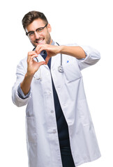 Young handsome doctor man over isolated background smiling in love showing heart symbol and shape...