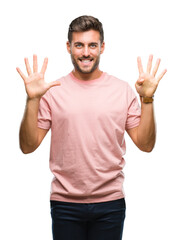 Young handsome man over isolated background showing and pointing up with fingers number nine while smiling confident and happy.