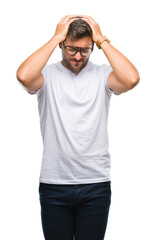 Fototapeta premium Young handsome man wearing glasses over isolated background suffering from headache desperate and stressed because pain and migraine. Hands on head.