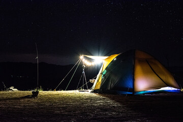 tent in the night in the mountains