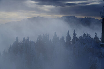 fog over the mountains, Postavaru Mountains, Romania. Viewpoint to Bucegi Mountains