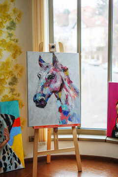 painting of a horse in an art studio