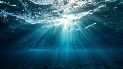 Light breaking through the surface of the water, ocean underwater view