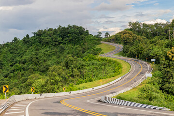 Beautiful Road countryside passes between the mountains. Nan province, Thailand.