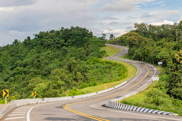 Beautiful Road countryside passes between the mountains. Nan province, Thailand.