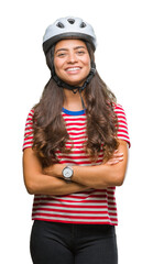 Young arab cyclist woman wearing safety helmet over isolated background happy face smiling with crossed arms looking at the camera. Positive person.