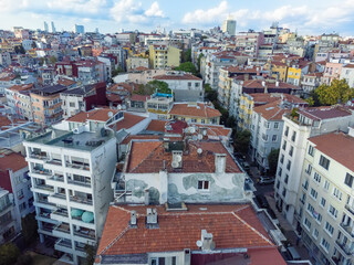 Close-up view of houses with bright roofs of residential buildings, buildings in the European part of the city in Istanbul on a sunny day, drone view .