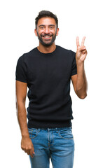 Adult hispanic man over isolated background smiling with happy face winking at the camera doing victory sign. Number two.