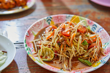 Close-up of spicy papaya salad on plate