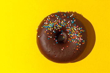 chocolate donuts on a yellow background