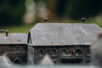 Wedding rings of the bride and groom on the model of the castle