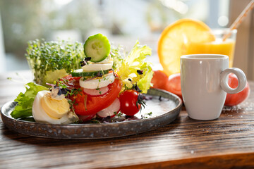 Healthy breakfast with cup of espresso  and freshly squeezed orange juice on rustic wooden table....