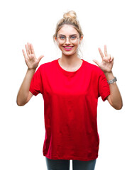 Young beautiful blonde woman wearing red t-shirt and glasses over isolated background showing and pointing up with fingers number eight while smiling confident and happy.