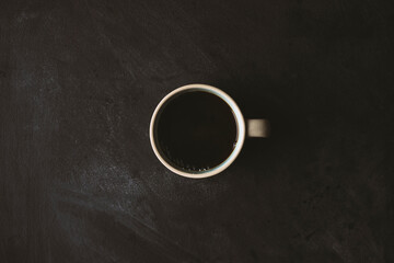 Coffee in a mug on black background