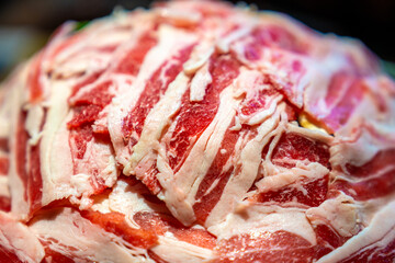 A plate of sliced meat rolls