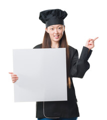 Young Chinese woman over isolated background wearing chef uniform holding banner very happy pointing with hand and finger to the side