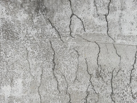 Flat lay image of cracked reinforced concrete surface due to shrinkage in the curing process