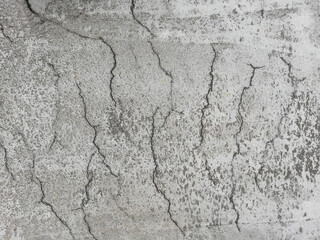 Flat lay image of cracks in reinforced concrete surface due to shrinkage in the curing process