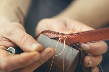 The process of working with the leather with a low depth of field