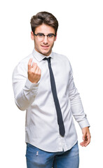 Young business man wearing glasses over isolated background Beckoning come here gesture with hand inviting happy and smiling