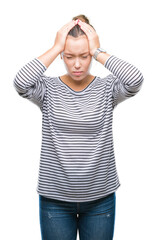 Young beautiful caucasian woman over isolated background suffering from headache desperate and stressed because pain and migraine. Hands on head.