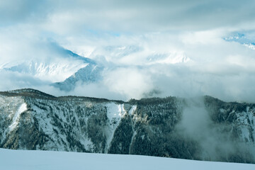 Mountain peaks in winter covered with snow and clouds, gorgeous view landscape, Caucasus mountains tetnuldi